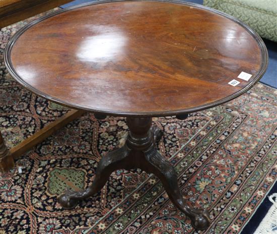 A George III mahogany tea table, with dished top and acanthus carved tripod, W.85cm